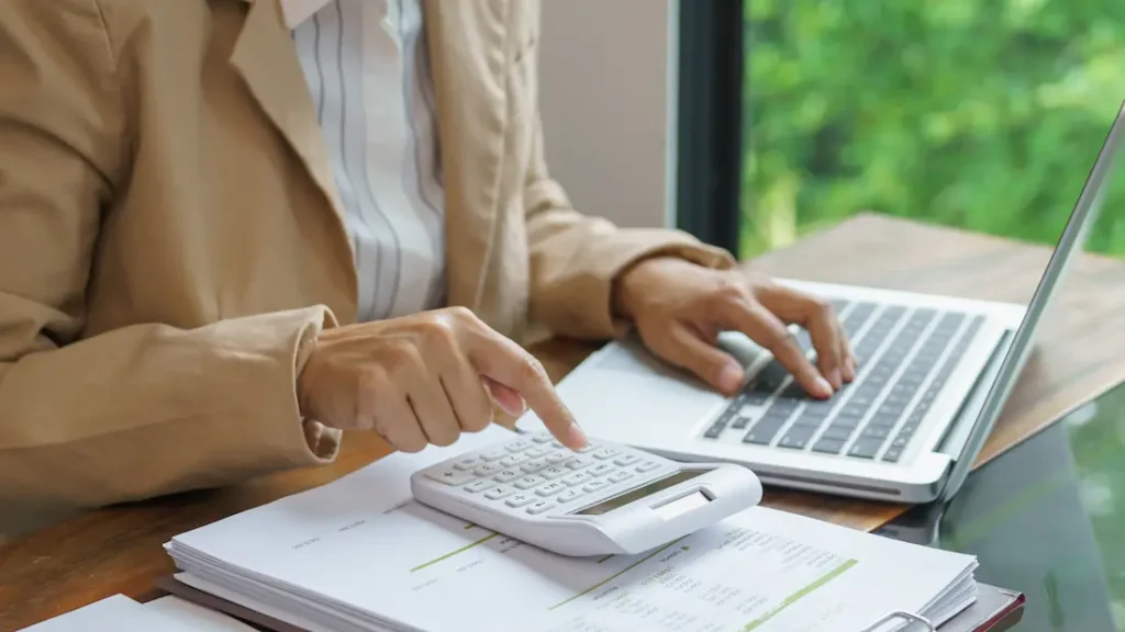 person reviewing paperwork looking for tax benefits