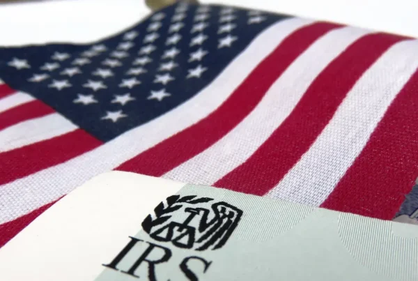 IRS tax forms and an American flag